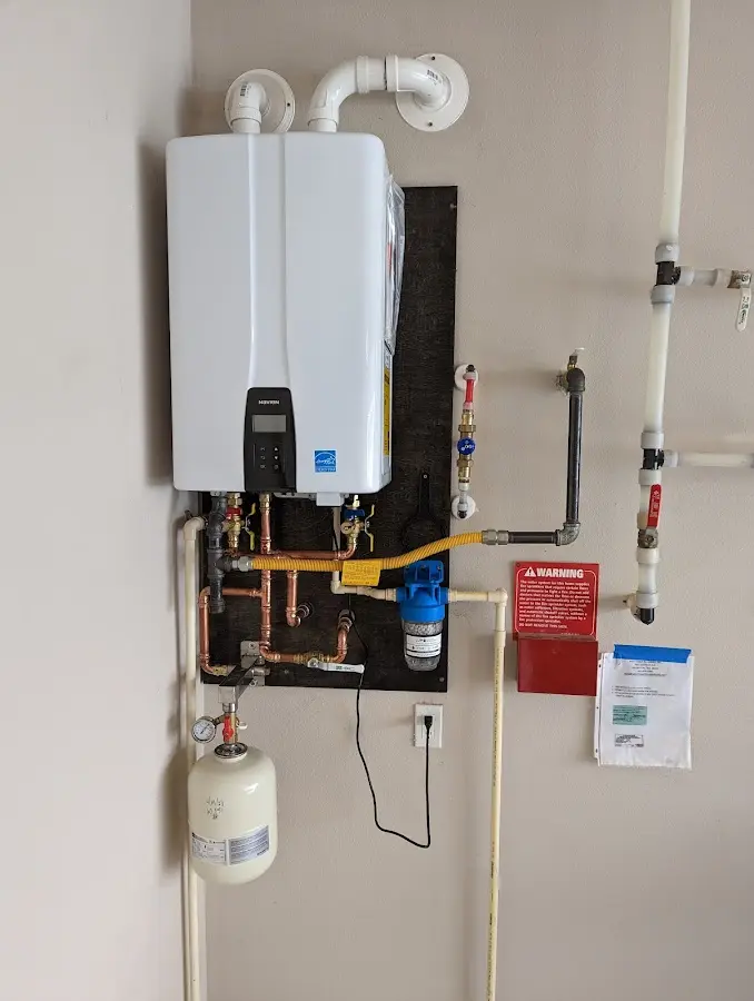 Professional plumber installing copper piping in a Bladensburg home